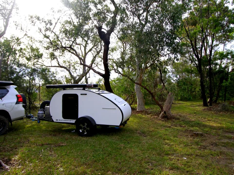 Breeze by Smidge teardrop camper trailer set up at Australian coastal campsite