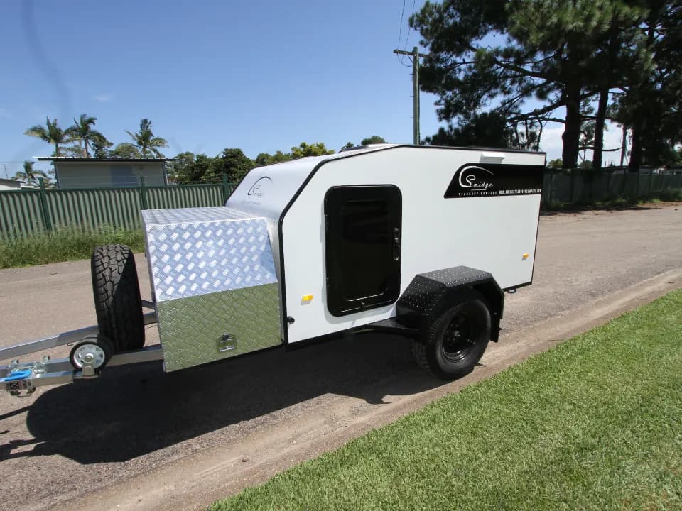 Anvil by Smidge squaredrop off-road camper trailer parked on street before heading to Victorian High Country