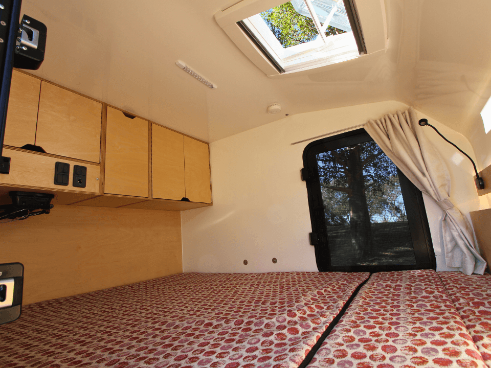 Anvil by Smidge squaredrop off-road camper trailer — sleeping area with overhead skylight
