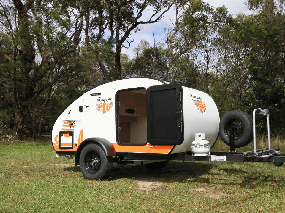 Breeze by Smidge teardrop camper trailer — rear door open showing galley kitchen access
