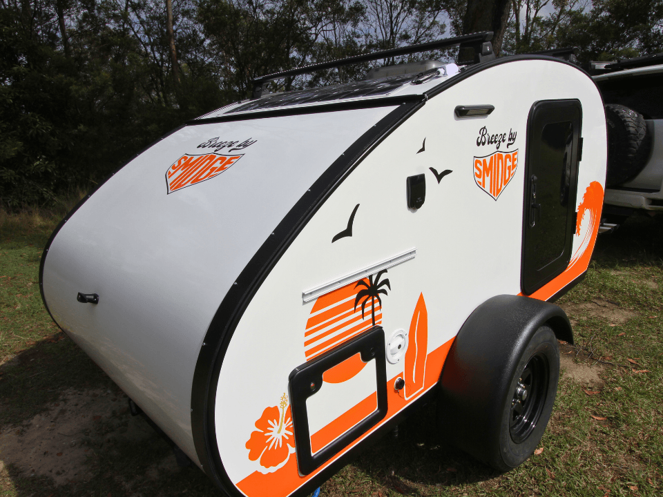 Breeze by Smidge teardrop camper trailer — side profile featuring surf-inspired graphics