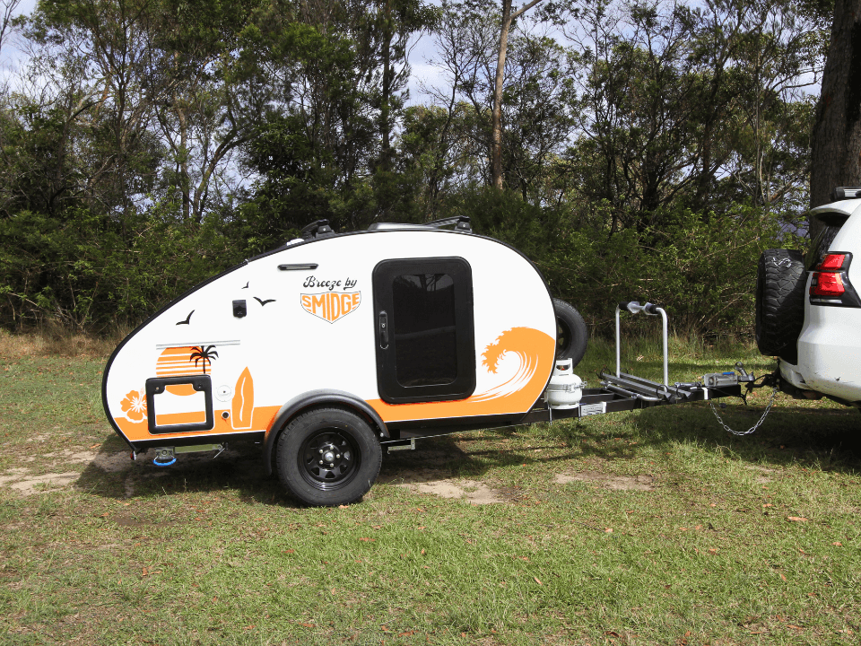 Breeze by Smidge teardrop camper trailer being towed on open Australian road — front view
